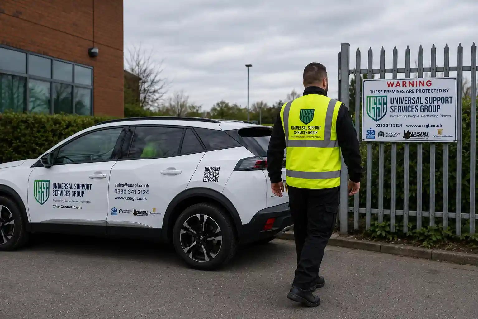 Security officer inspecting a protected commercial premises with security signage and patrol vehicle in the United Kingdom.